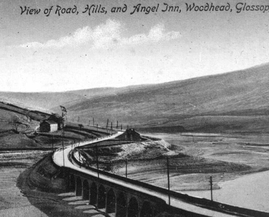 View of road, hills and Angel Inn